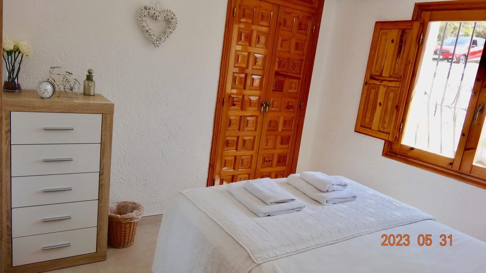 Double room with ample storage, rejas and black out shutters on windows.