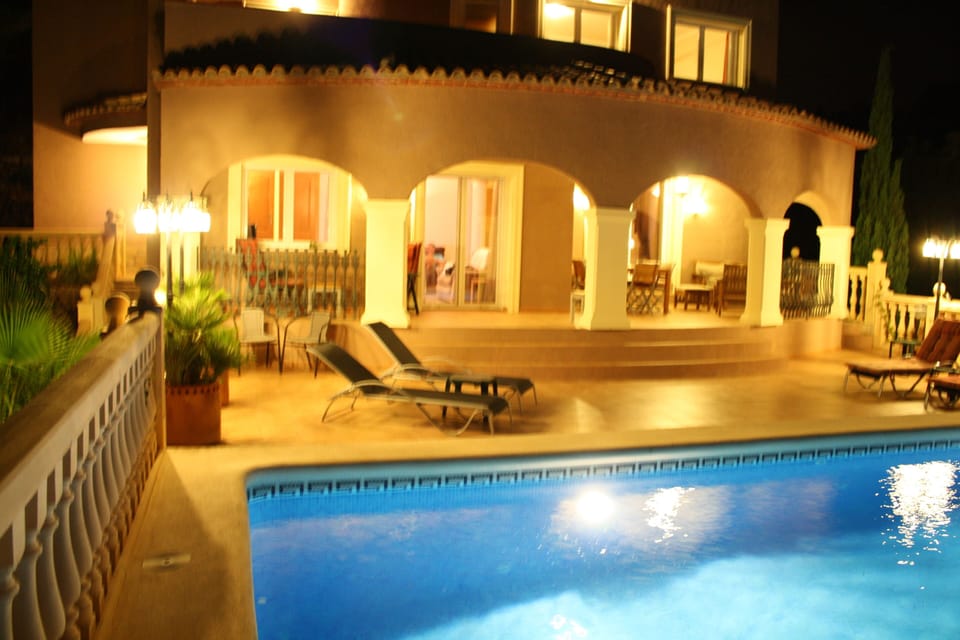 Villa at night perfect for al fresco dining. There is also a pool light.