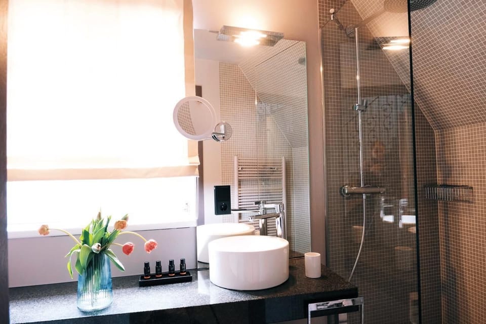 Designer toiletries, hair dryer, bathrobes, slippers