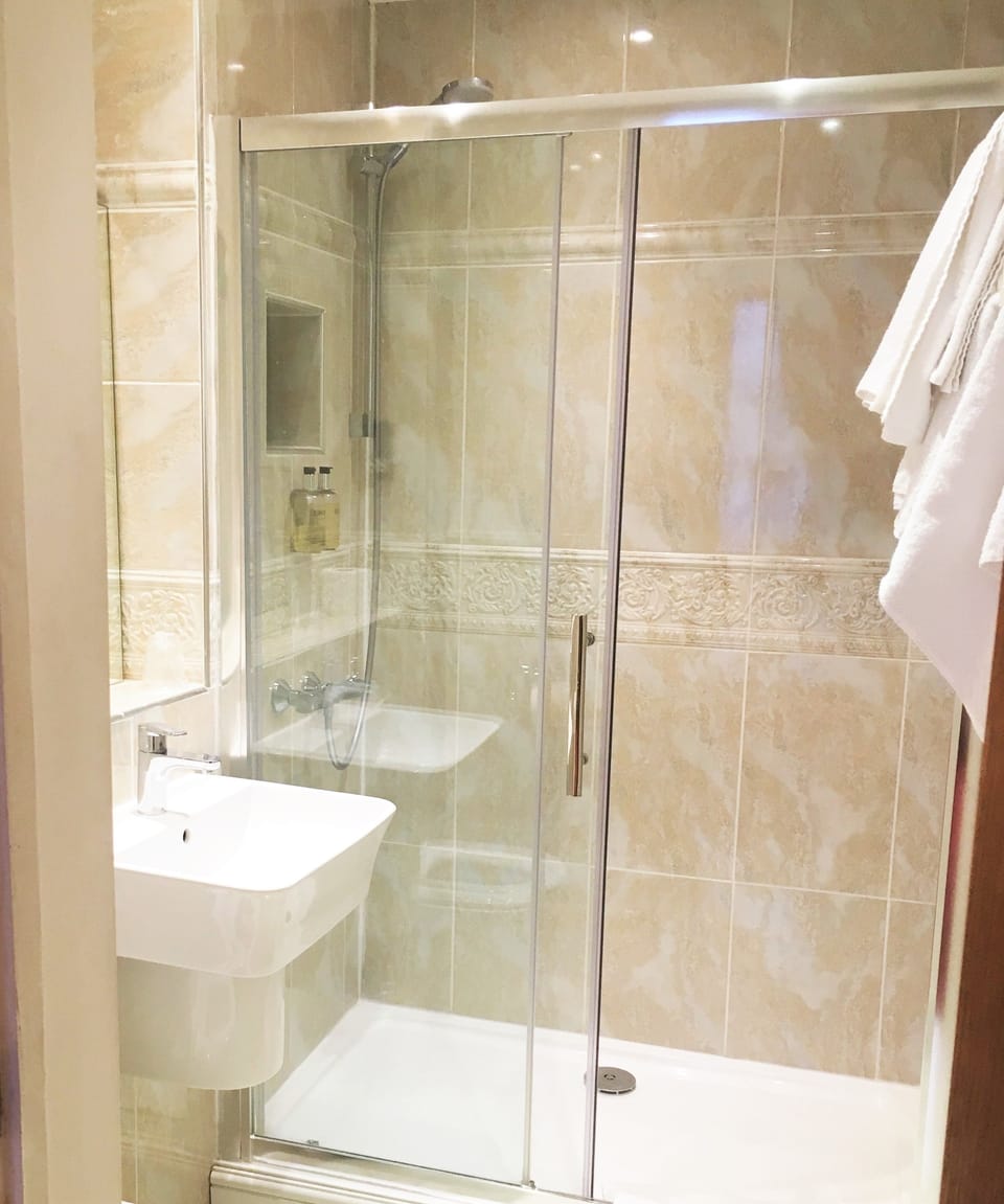 Shower, free toiletries, hair dryer, towels