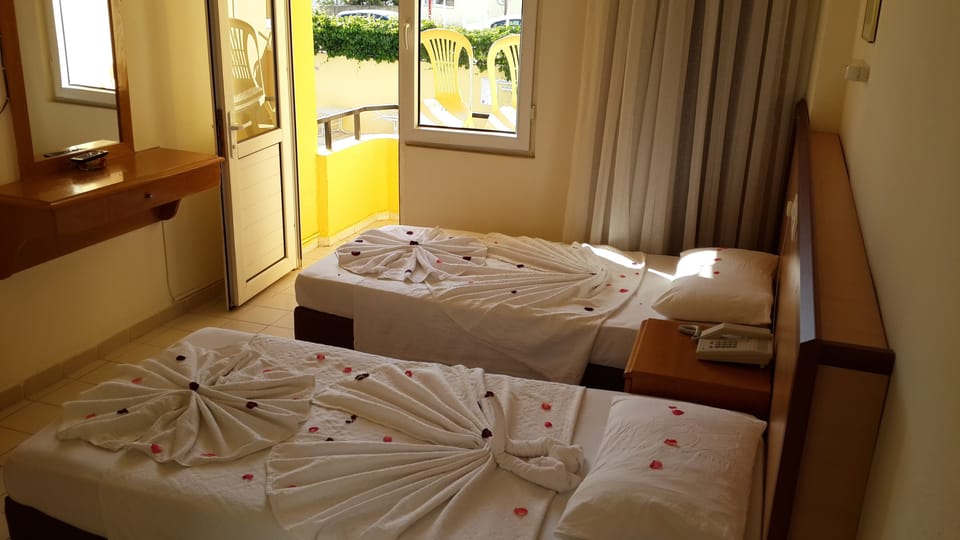 Desk, laptop workspace, free WiFi, bed sheets