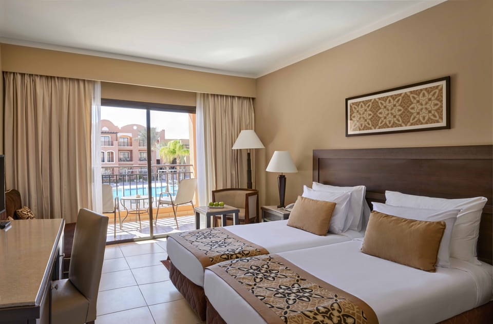 Superior Room, 2 Twin Beds, Pool View | Minibar, in-room safe, individually furnished, free cribs/infant beds