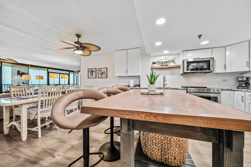 Enjoy casual seating with three barstools at the kitchen island, ideal for quick bites or socializing while you cook