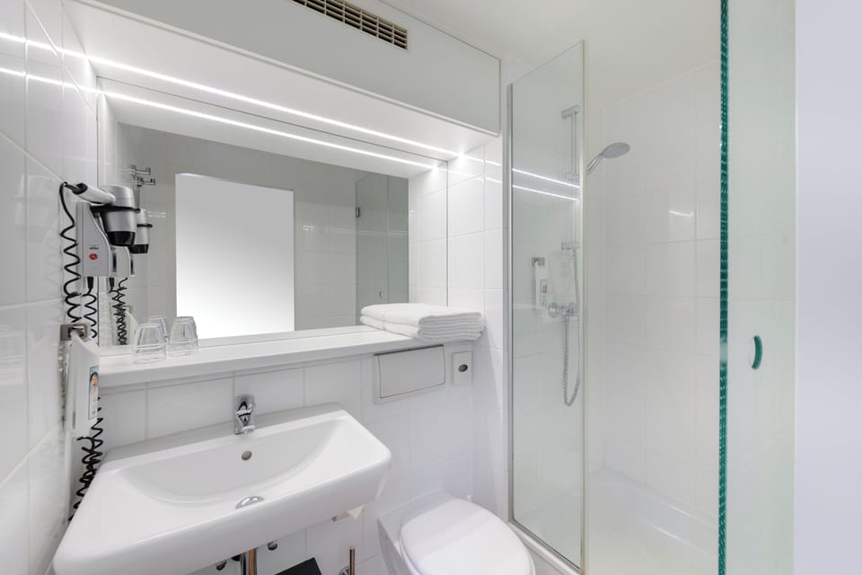 Shower, eco-friendly toiletries, hair dryer, towels
