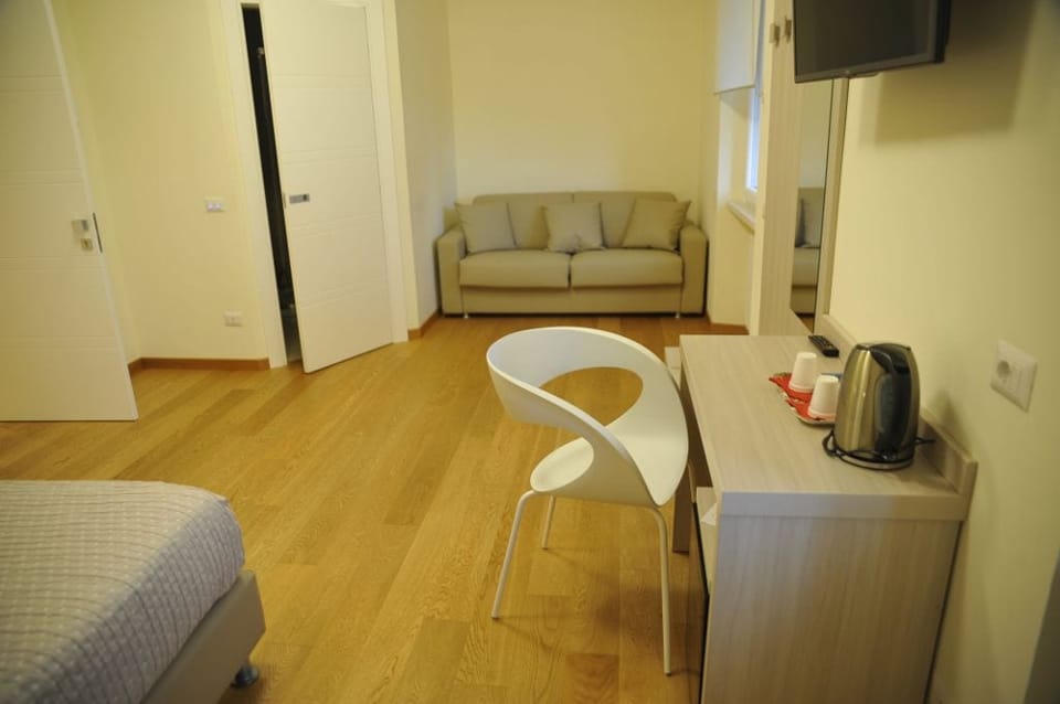 Standard Triple Room, Sea View | Minibar, in-room safe, desk, free WiFi