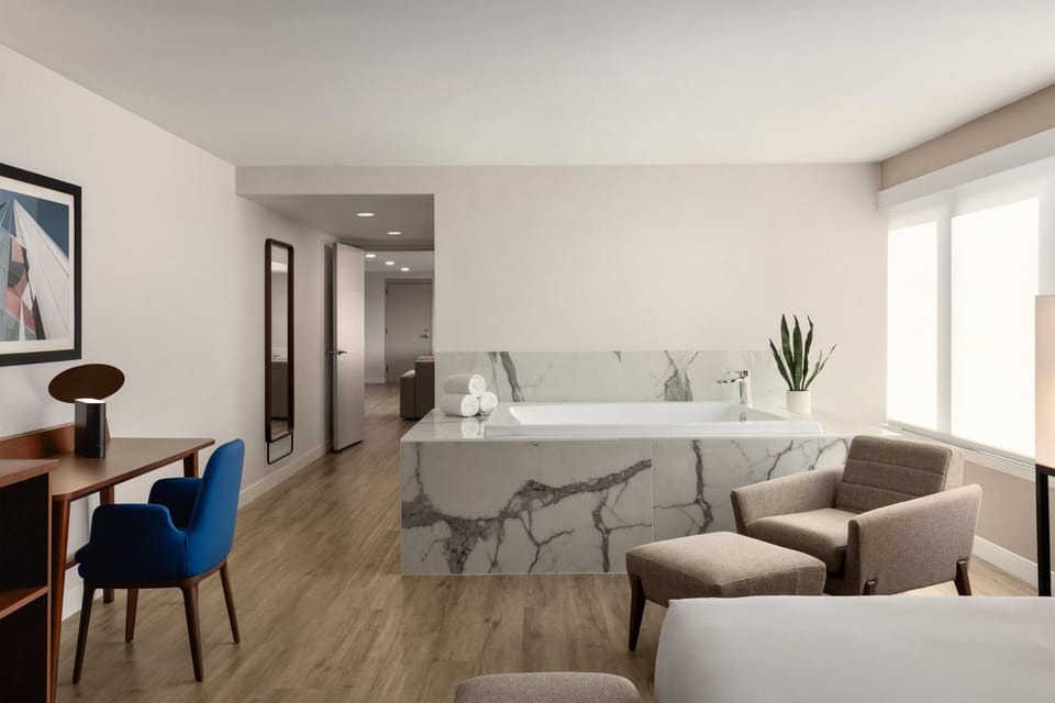 Suite, 1 King Bed, Kitchen | Living area | Flat-screen TV, pay movies, MP3 dock