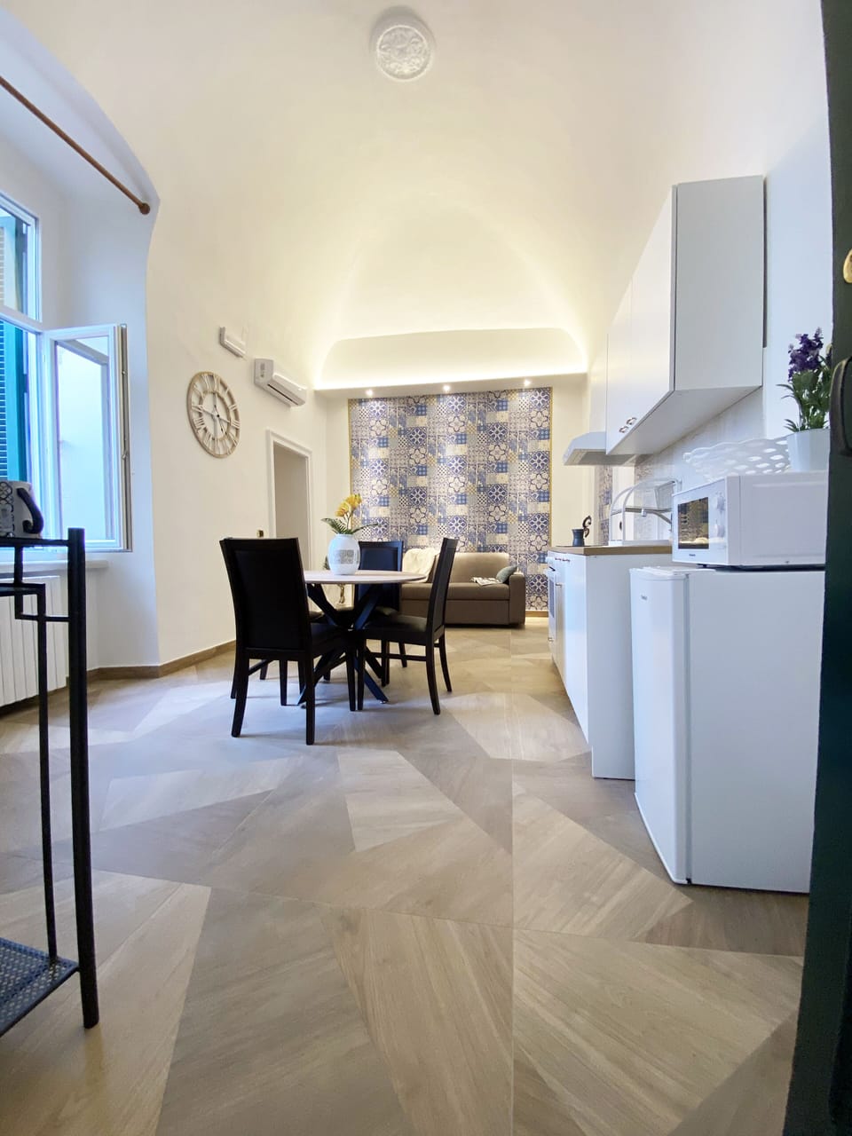 Deluxe Apartment, Garden View | Private kitchen | Fridge, cleaning supplies