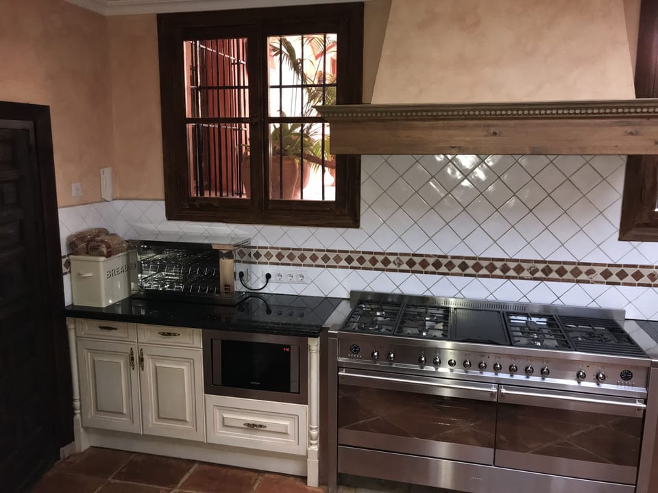 Kitchen with semi comercial cooker, toaster.  Café machine etc 