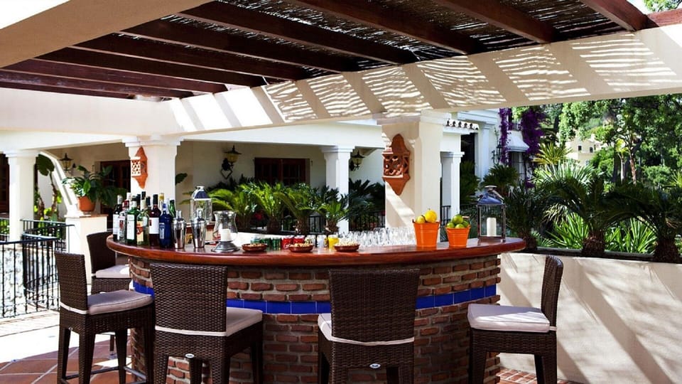 Outside bar area with fridges and BBQ and dinning area