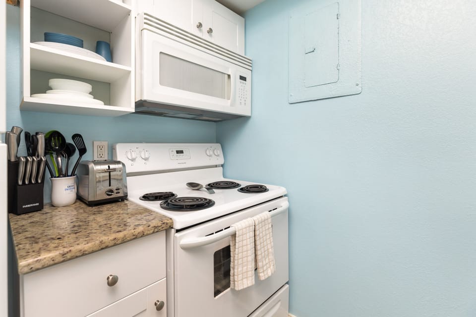 Your fully equipped kitchen invites you to create memorable meals with granite counters, stove, microwave, and everything needed for comfortable cooking.