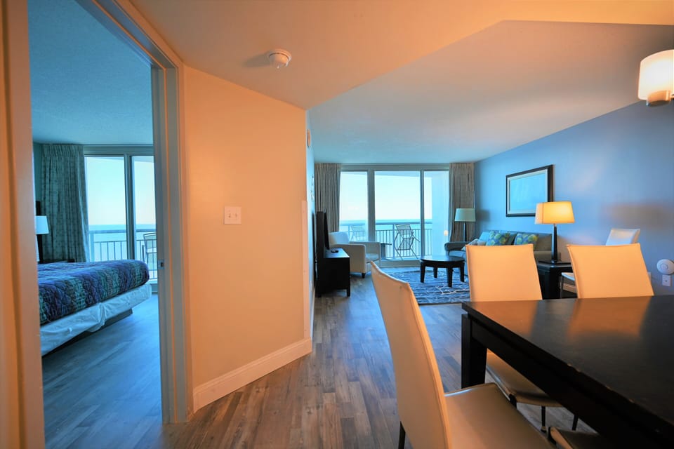 Spacious condo with ocean views, modern decor, and an open floor plan.