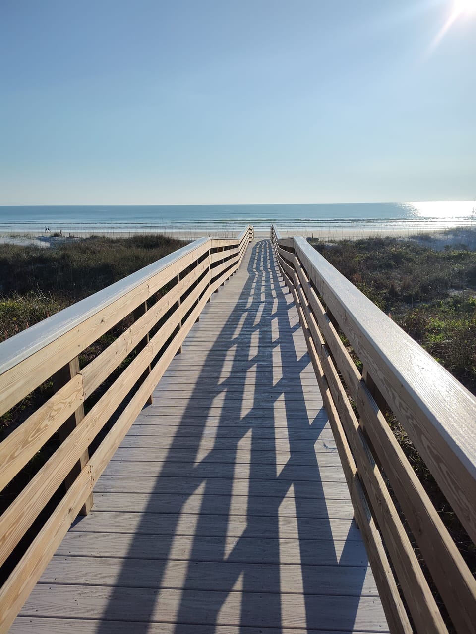 newly refurbished boardwalk over the dunes to an awesome beach