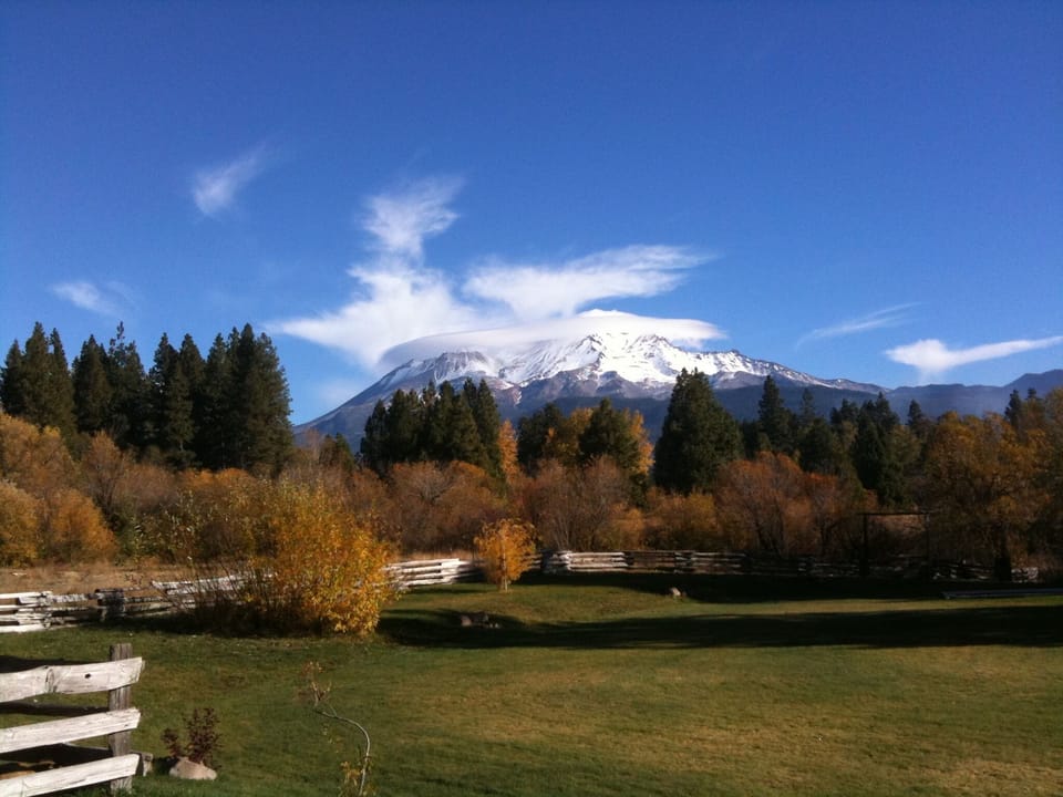 Mt. Shasta in Fall shines brightly over the change of seasons