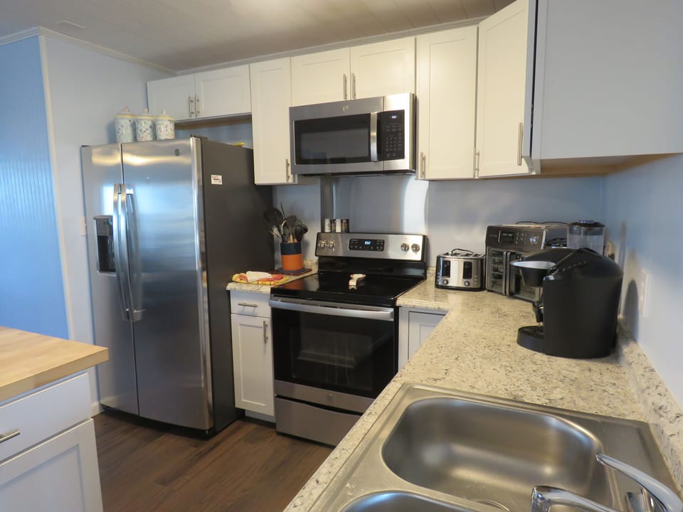 Kitchen has 2 coffee makers: Mr. Coffee and a Keurig 
