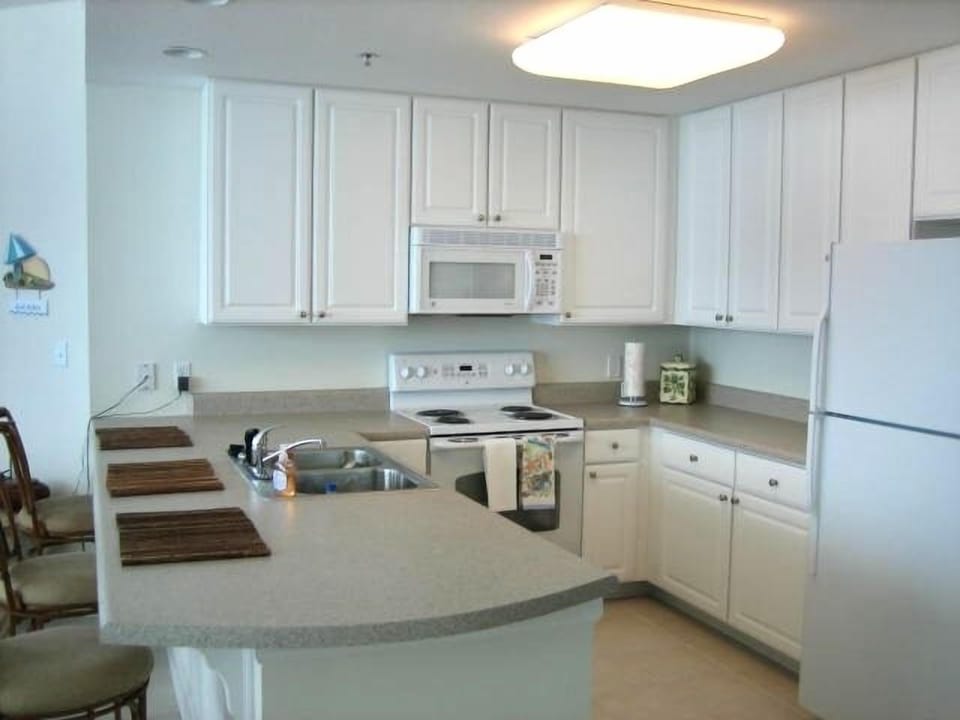 Spacious modern kitchen with full array of appliances
