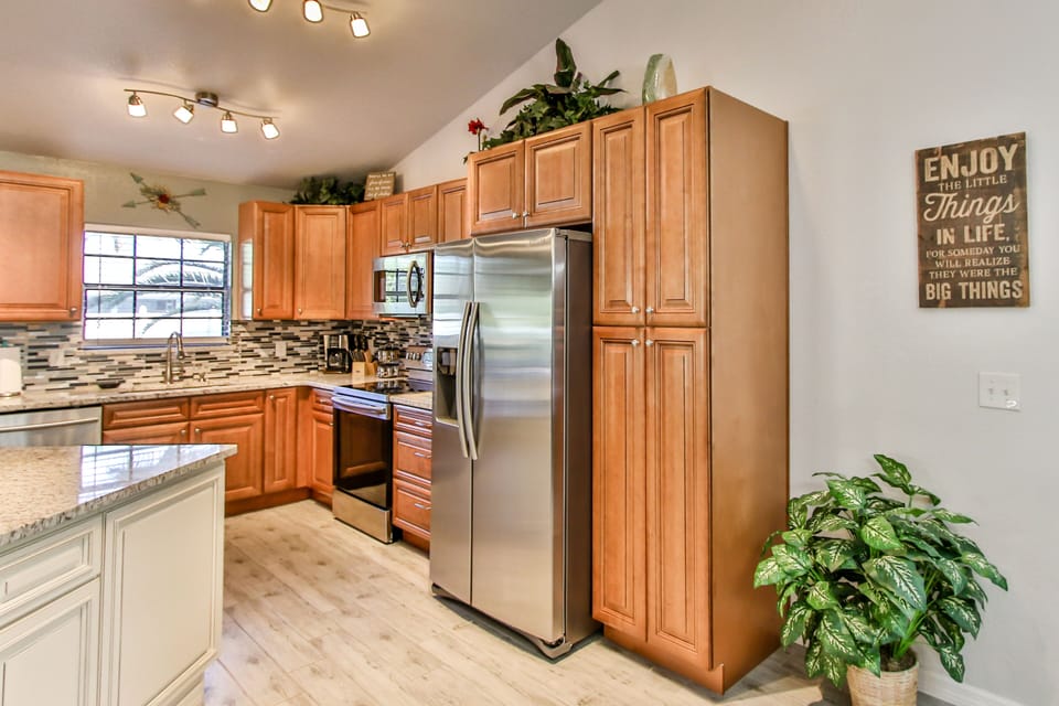 Stainless steel appliances and plenty of cabinet space in this modern kitchen.