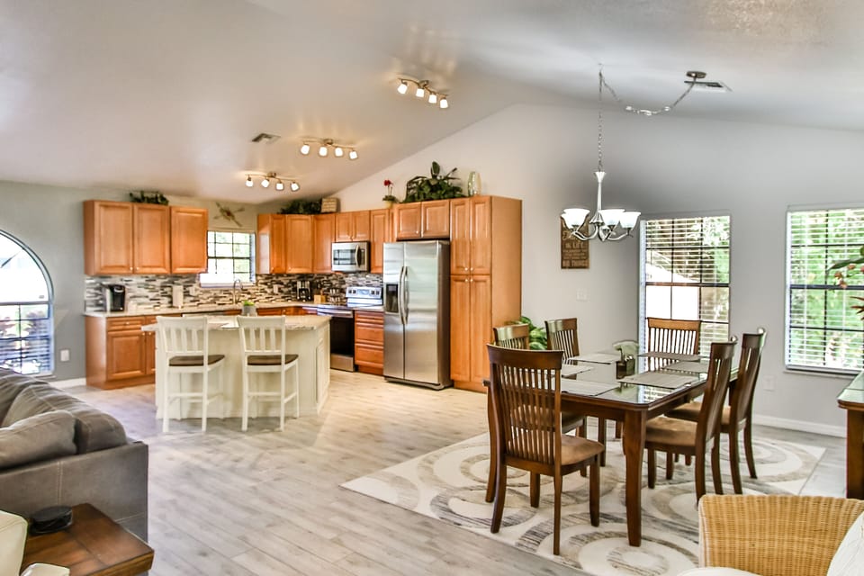 Dining table for six and kitchen counter with 2 stools for your dining pleasure.