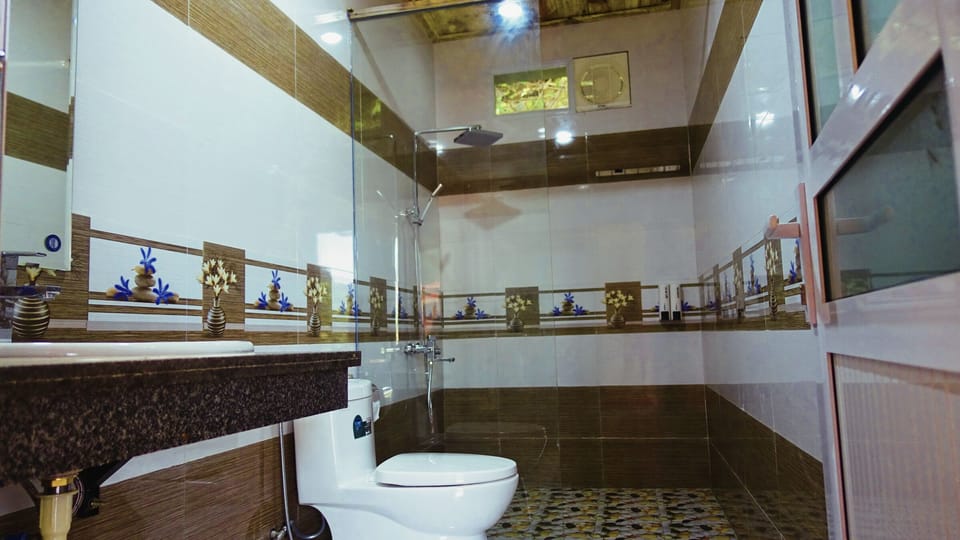 Shower, free toiletries, hair dryer, slippers