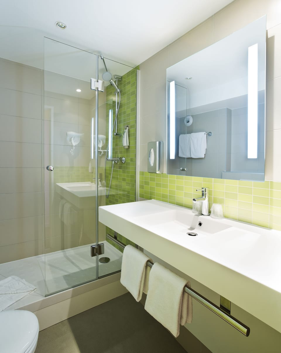 Shower, eco-friendly toiletries, hair dryer, towels
