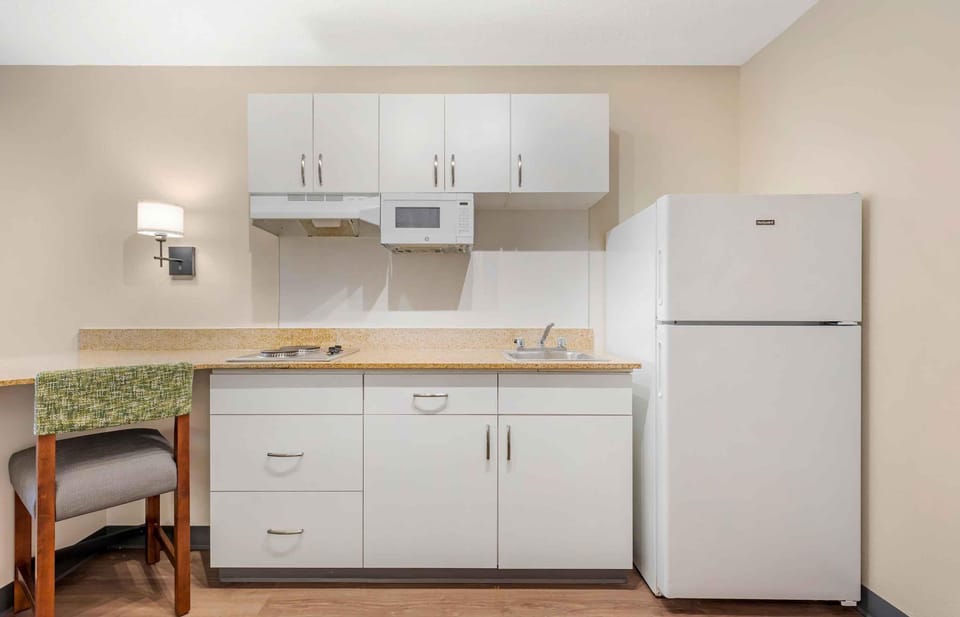 Studio, 1 King Bed, Non Smoking | Private kitchen | Coffee/tea maker, full-size fridge, microwave, stovetop