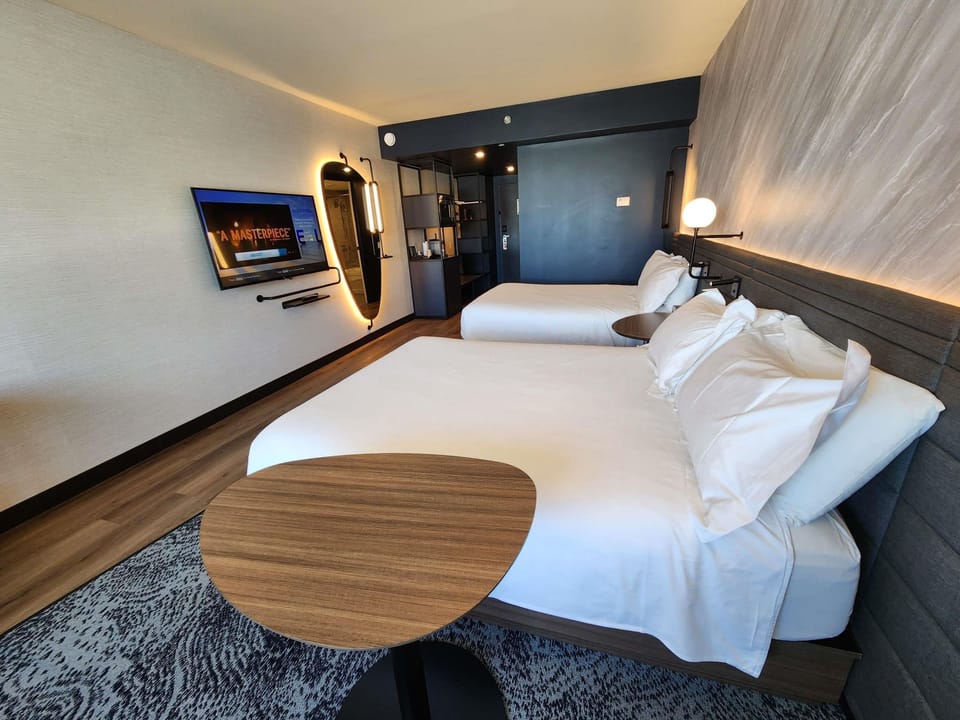 Down comforters, pillowtop beds, in-room safe, desk