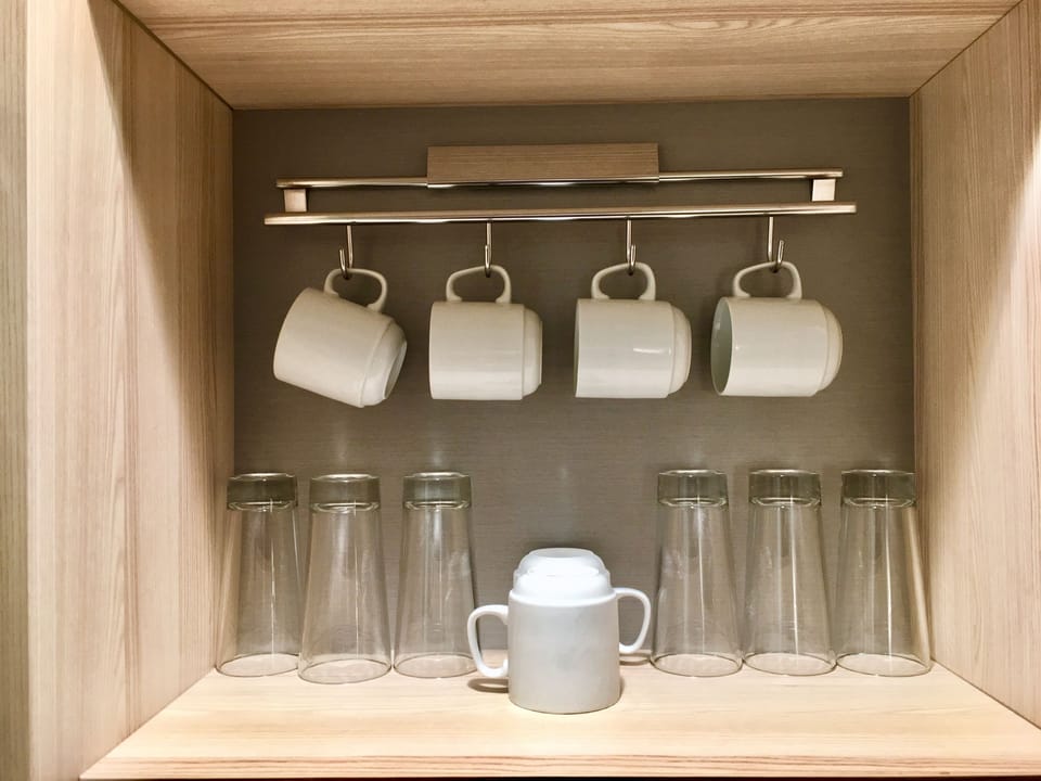 Premium bedding, desk, laptop workspace, blackout drapes