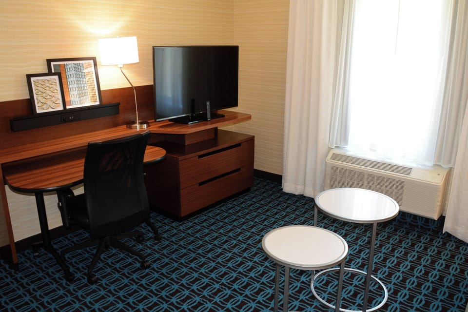 Suite, 1 King Bed with Sofa bed | Living room | 50-inch LCD TV with cable channels, TV, first-run movies
