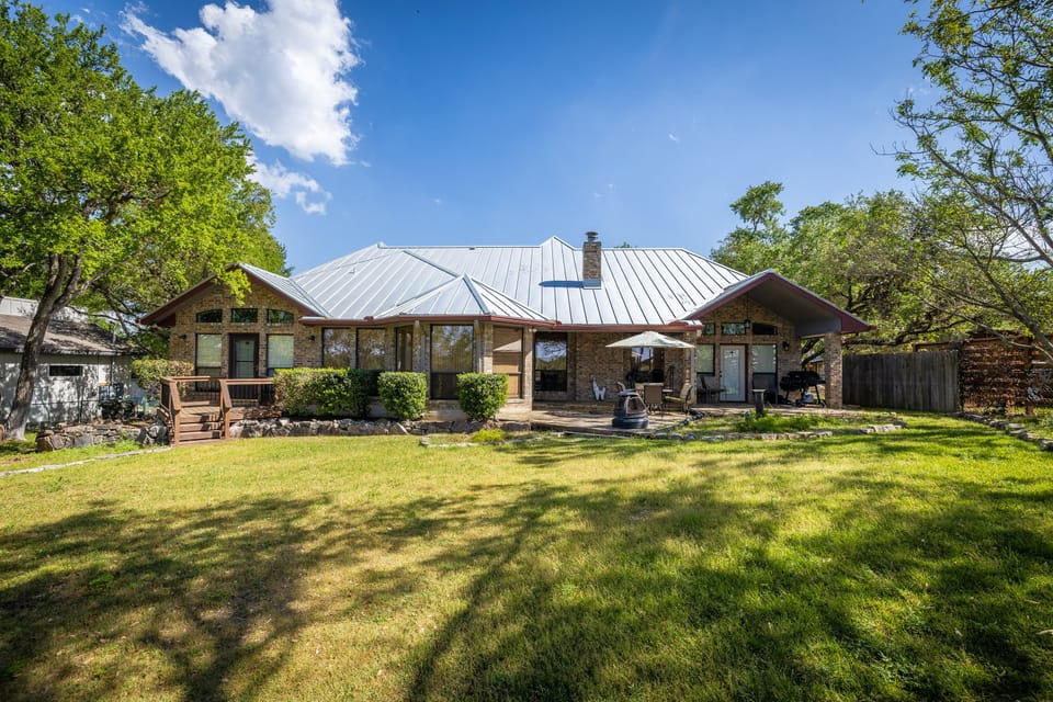 Backyard with outdoor dining and grill