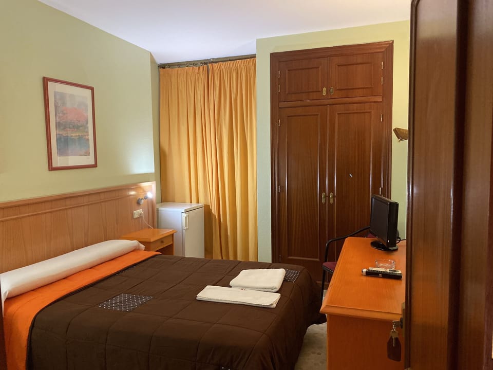 Comfort Single Room | Pillowtop beds, blackout drapes, iron/ironing board (on request)