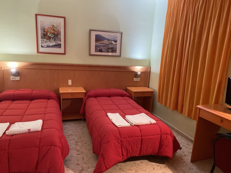 Double or Twin Room | Pillowtop beds, blackout drapes, iron/ironing board (on request)