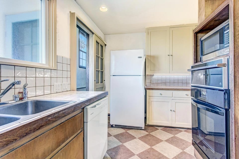 Fridge, microwave and oven for all your cooking needs.