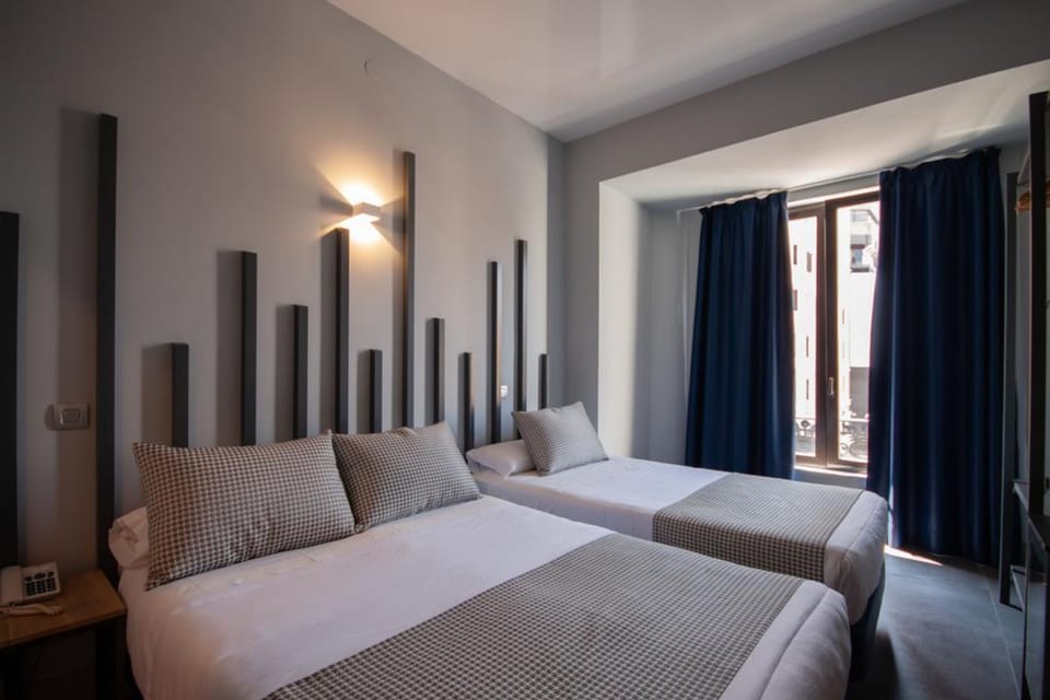 Triple Room, City View | Minibar, in-room safe, soundproofing, free WiFi