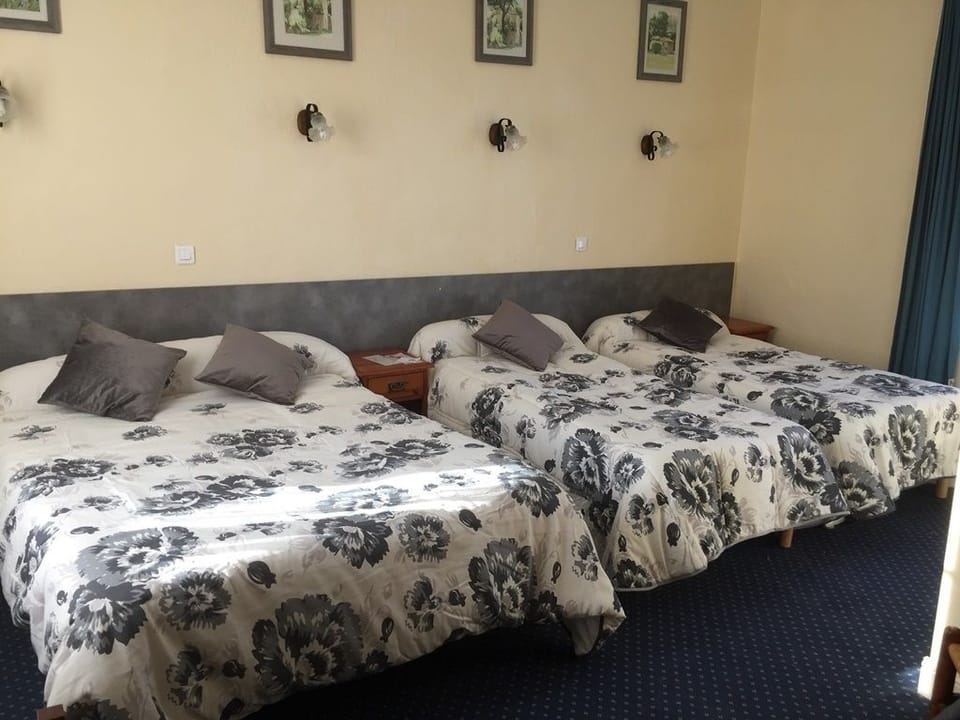 Quadruple Room | Blackout drapes, iron/ironing board, free WiFi, bed sheets