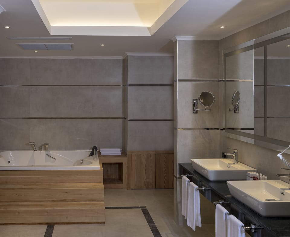 Suite, 1 King Bed | Bathroom | Deep soaking tub, free toiletries, towels