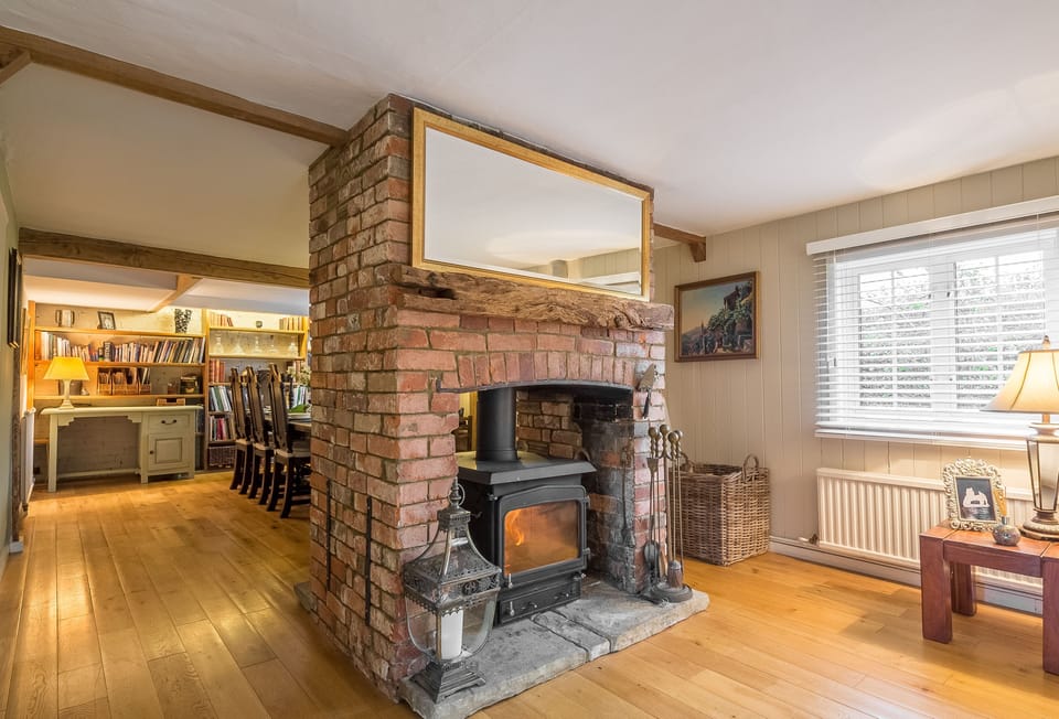 Cherry Cottage features a double sided wood burning stove which keeps both the sitting area and dining area cosy
