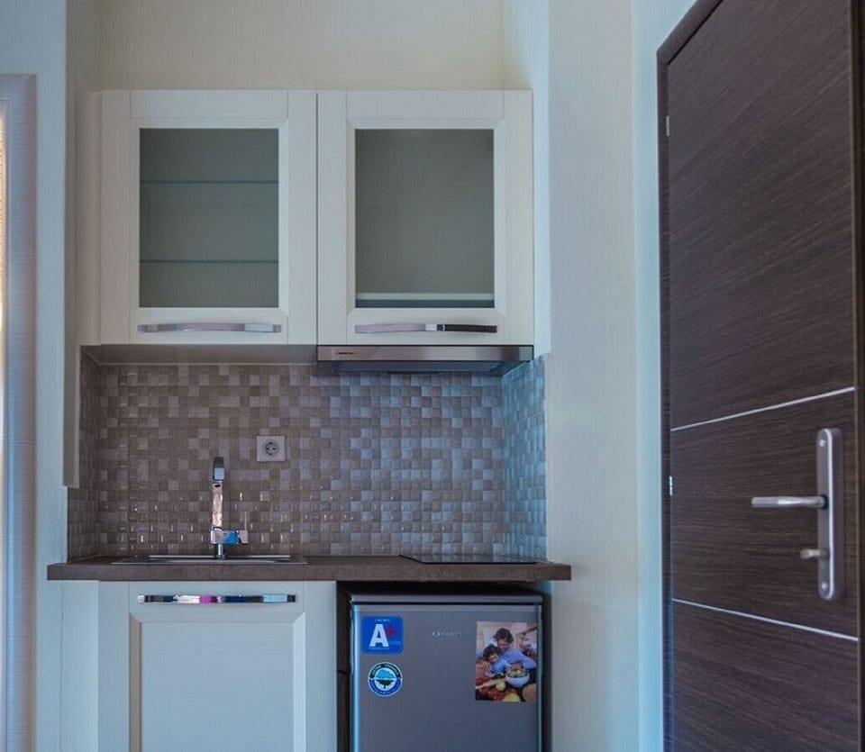 Mini-fridge, electric kettle, cookware/dishes/utensils