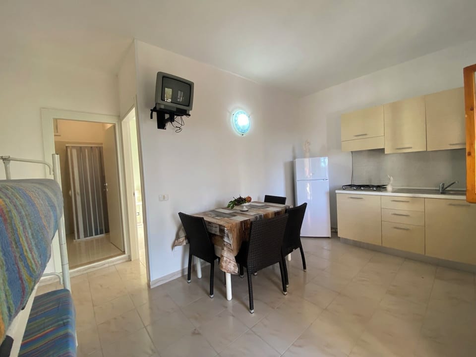 Apartment, 1 Bedroom (4 PAX) | Living area | Flat-screen TV