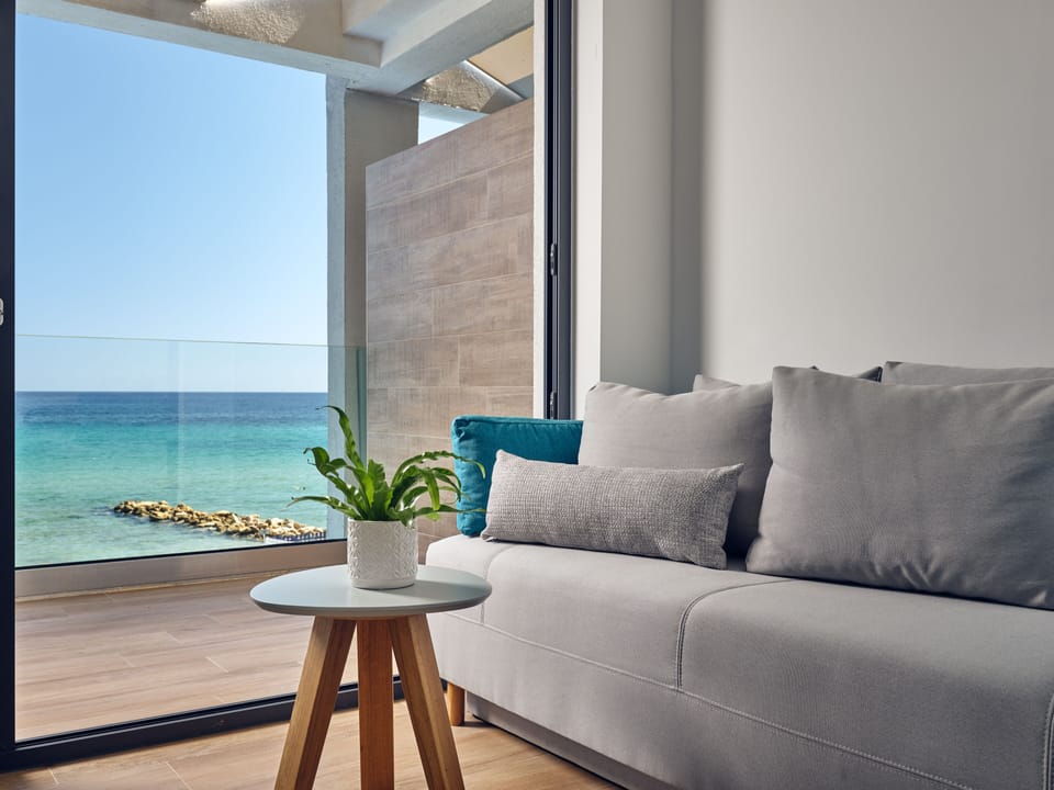 Seaside Suite with Panoramic Sea View | Living area | Flat-screen TV