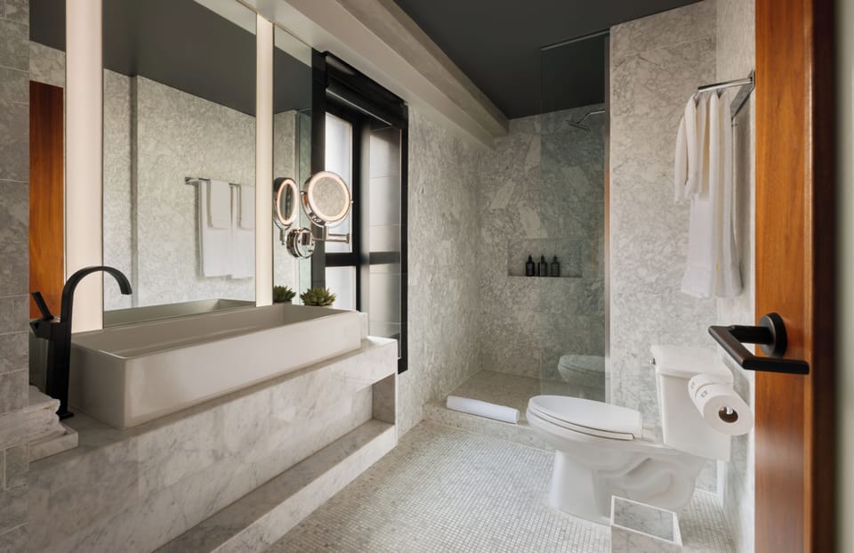 Club Studio | Bathroom | Designer toiletries, hair dryer, slippers, towels