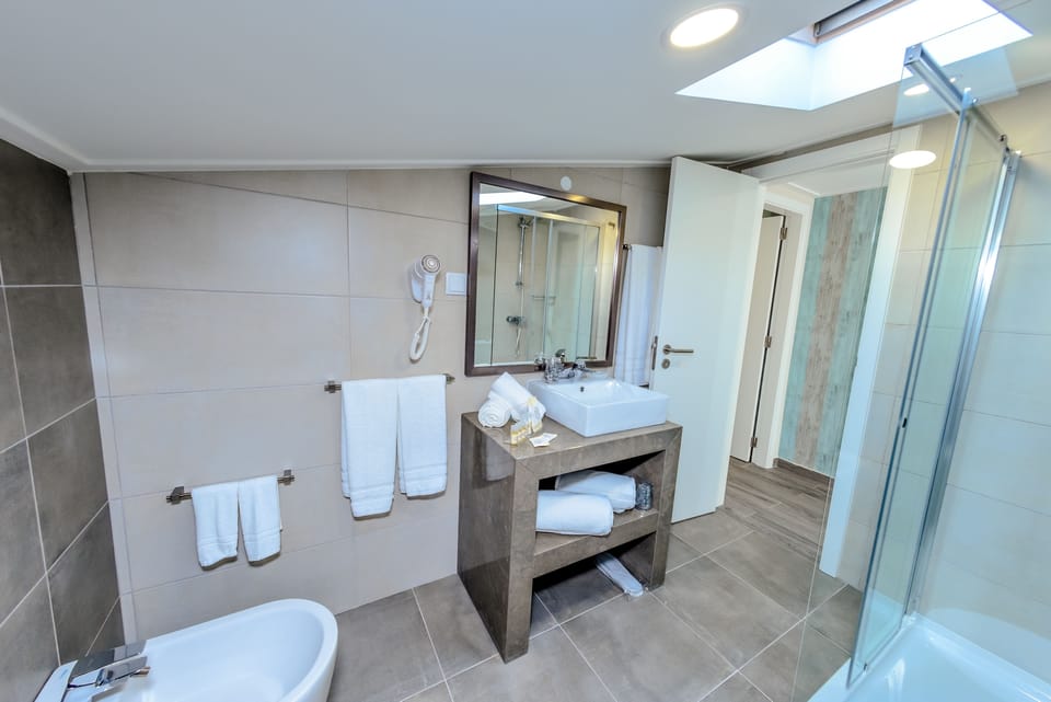 Family Studio, 2 Bedrooms, Balcony, Pool View | Bathroom | Shower, free toiletries, hair dryer, towels