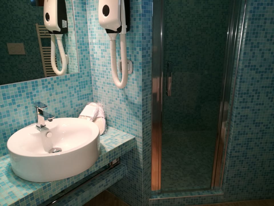 Shower, free toiletries, hair dryer, slippers
