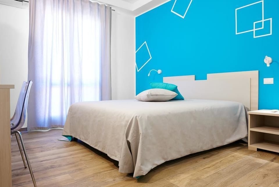 Triple Room, Balcony | Down comforters, desk, iron/ironing board, free WiFi