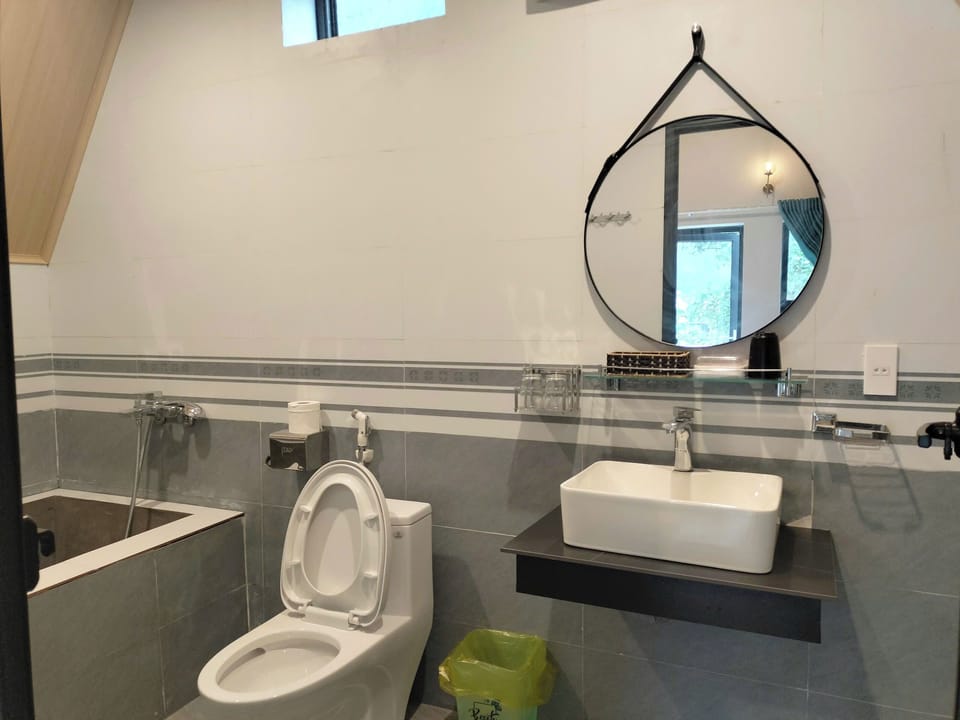 Deluxe Quadruple Bungalow, Ground Floor | Bathroom | Shower, free toiletries, hair dryer, slippers