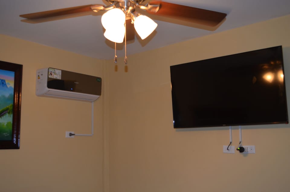 Bedroom with 42' TV and Air Conditioner