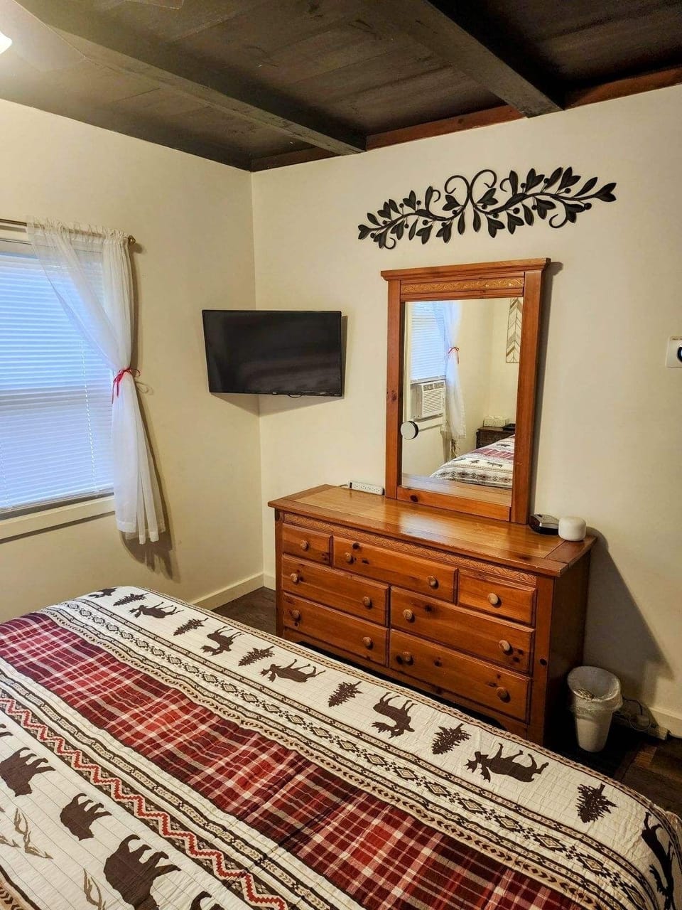 First floor Primary bedroom awaits your stay.  