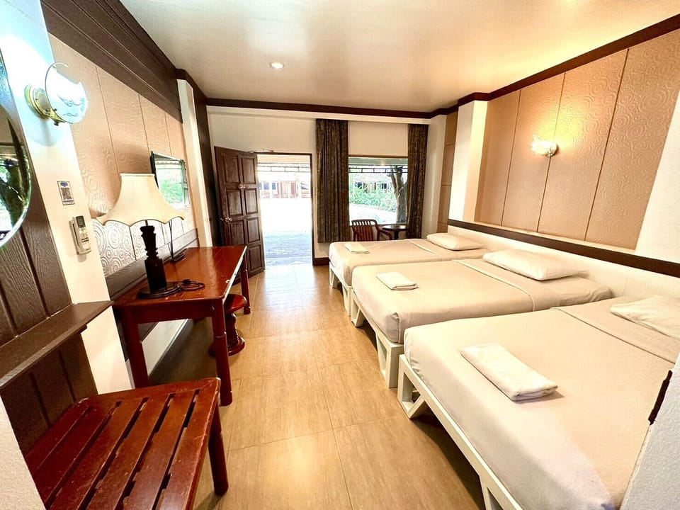 Basic Triple Room ( 3 Single Beds) | Desk, blackout drapes, soundproofing, free WiFi