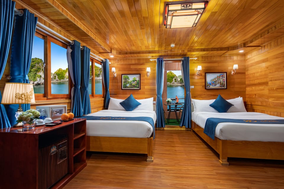 Deluxe Family Room | Minibar, in-room safe, desk, laptop workspace