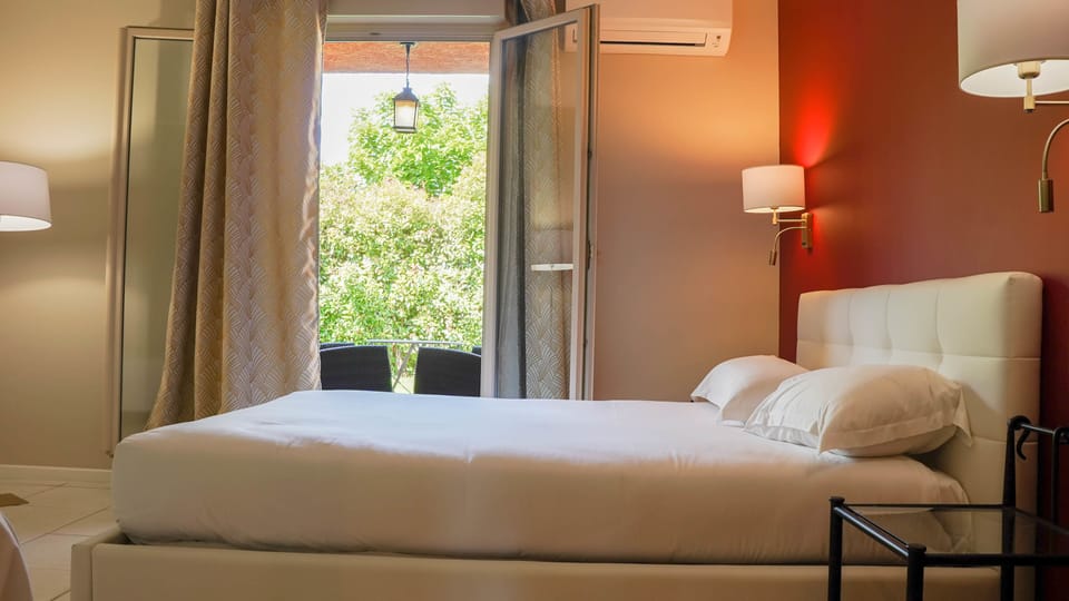 Triple Room | Desk, iron/ironing board (on request), cribs (surcharge), WiFi (free)