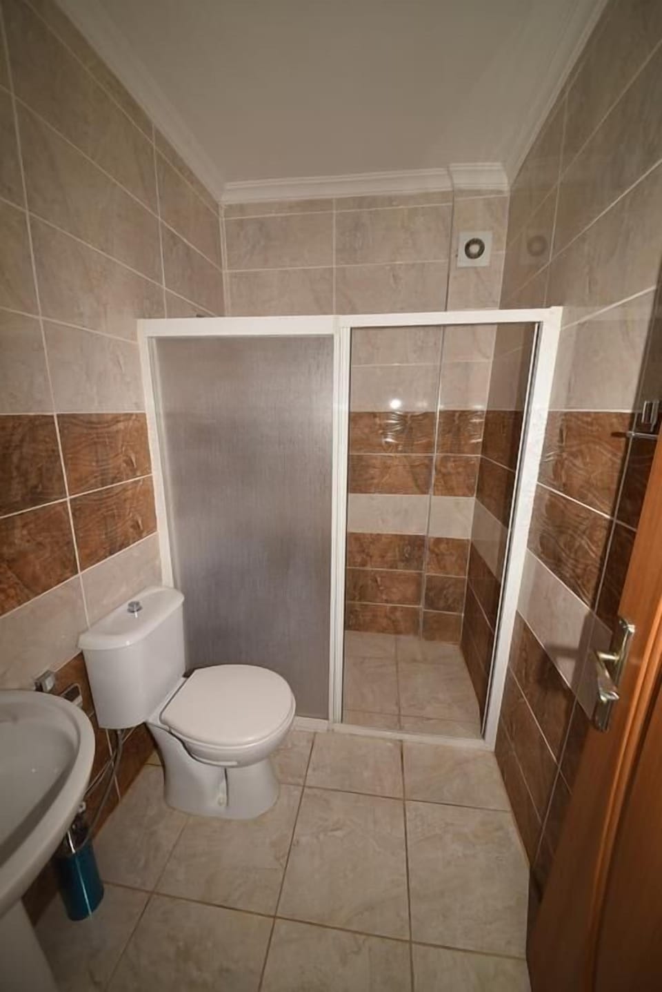 Shower, hair dryer, slippers, towels