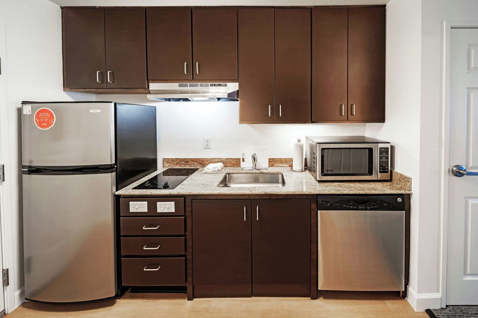 Studio, 1 King Bed with Sofa bed | Private kitchen | Fridge, microwave, stovetop, dishwasher